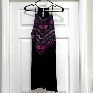 Never Worn. Small black dress with design